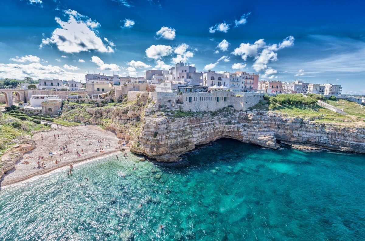 Cliffside view of Polignano a Mare, Italy, a top honeymoon destination