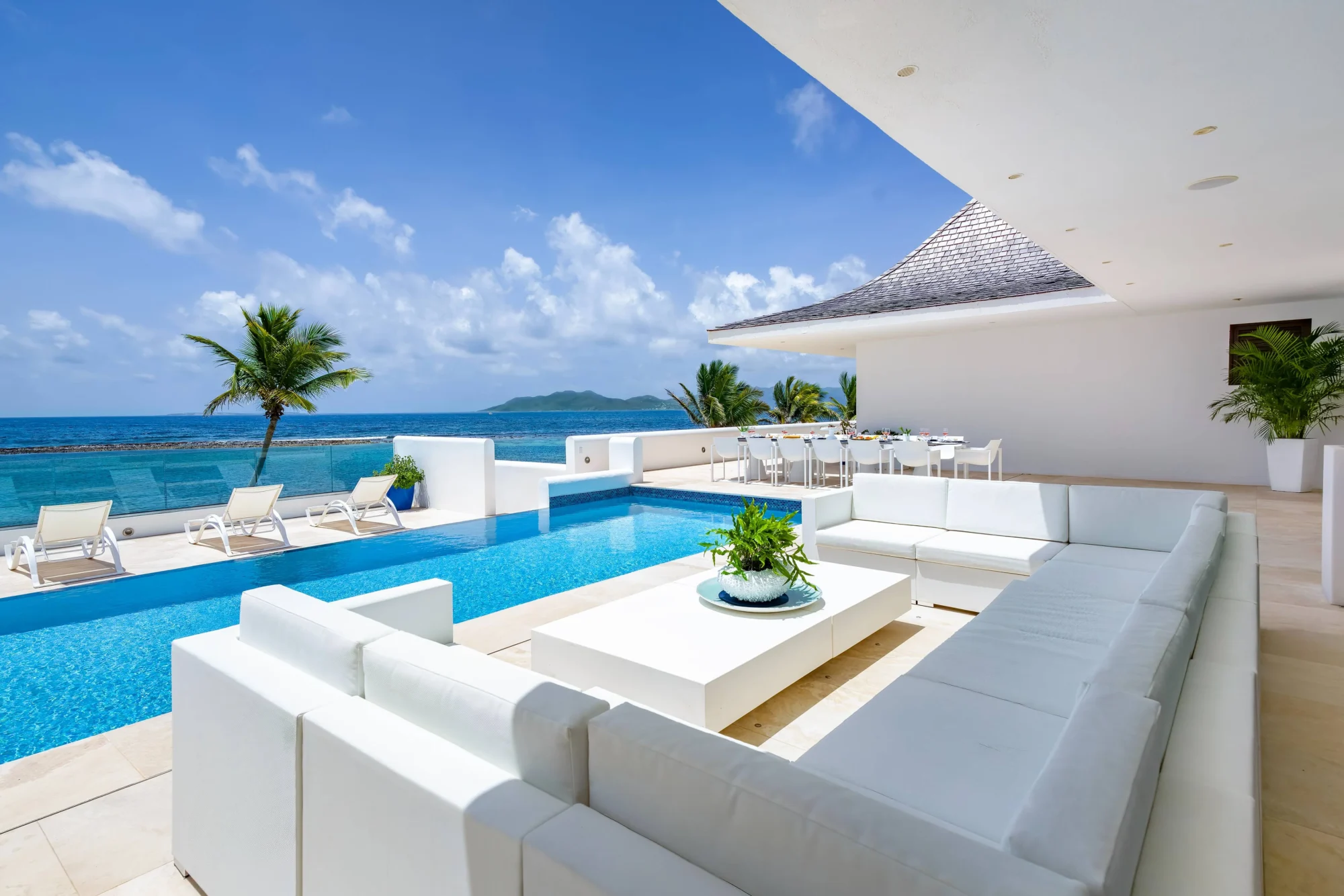 Luxury Anguilla villa with infinity pool, outdoor seating, and ocean view. Perfect for a destination wedding.