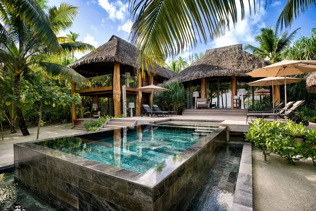 Luxury villa with a turquoise pool on Tetiaroa, perfect for a Tetiaroa wedding or honeymoon.
