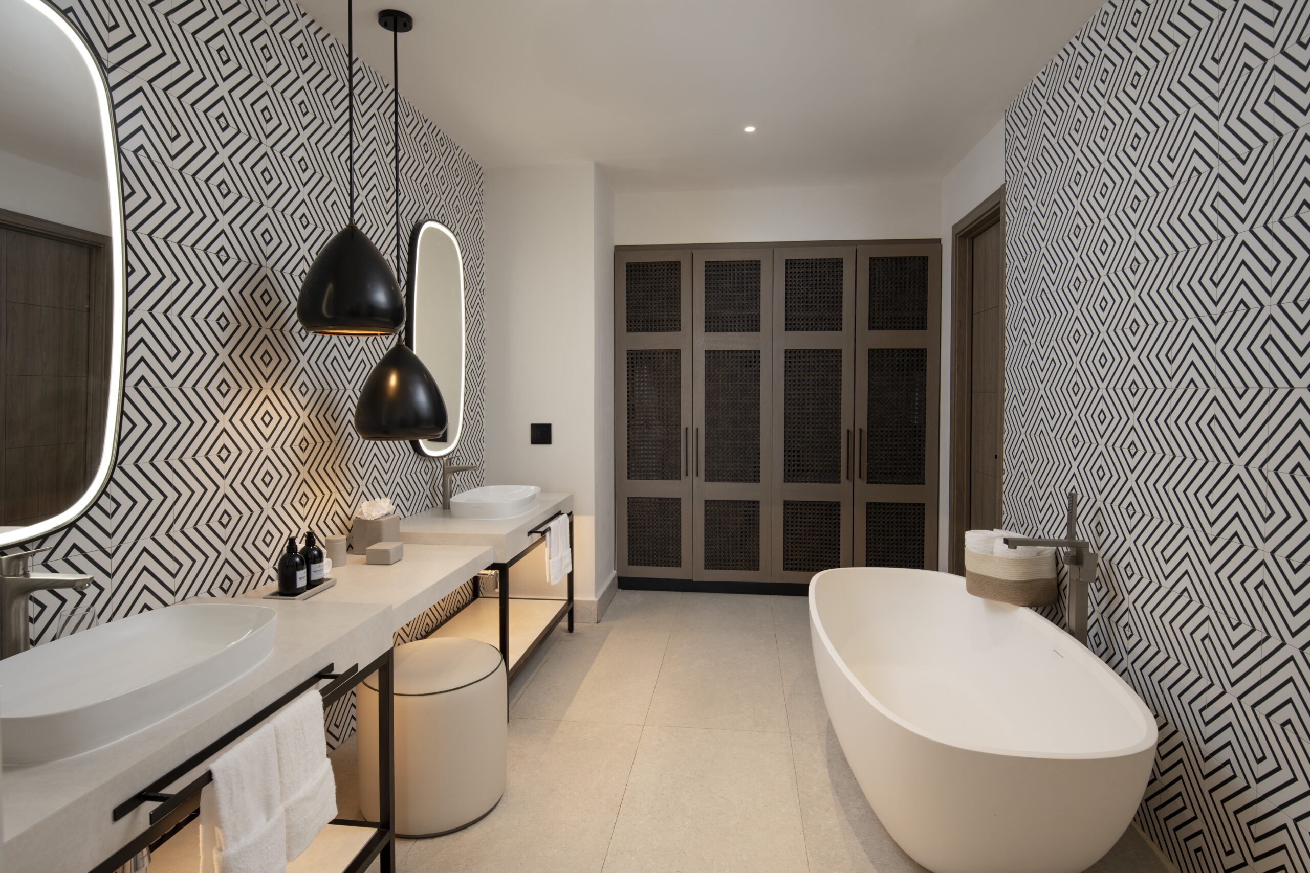 Elegant bathroom with patterned walls at Zemi Miches All-Inclusive Resort