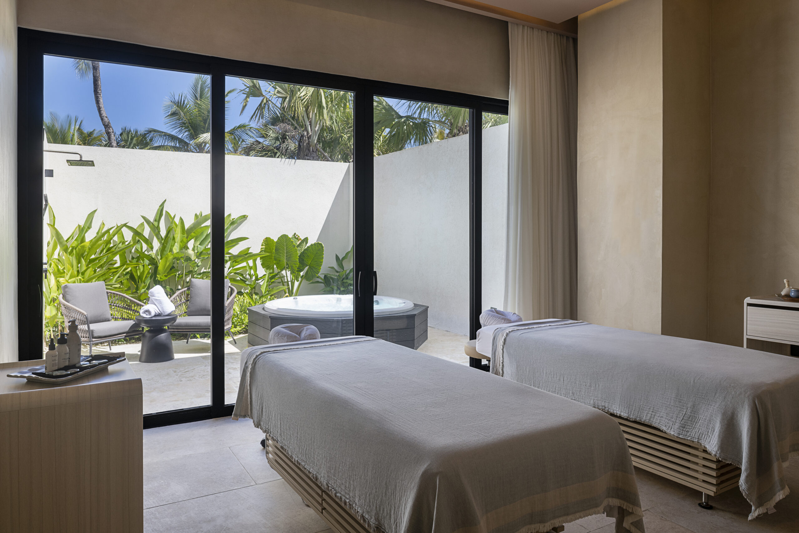Spa room with massage tables and jacuzzi at Zemi Miches All-Inclusive Resort