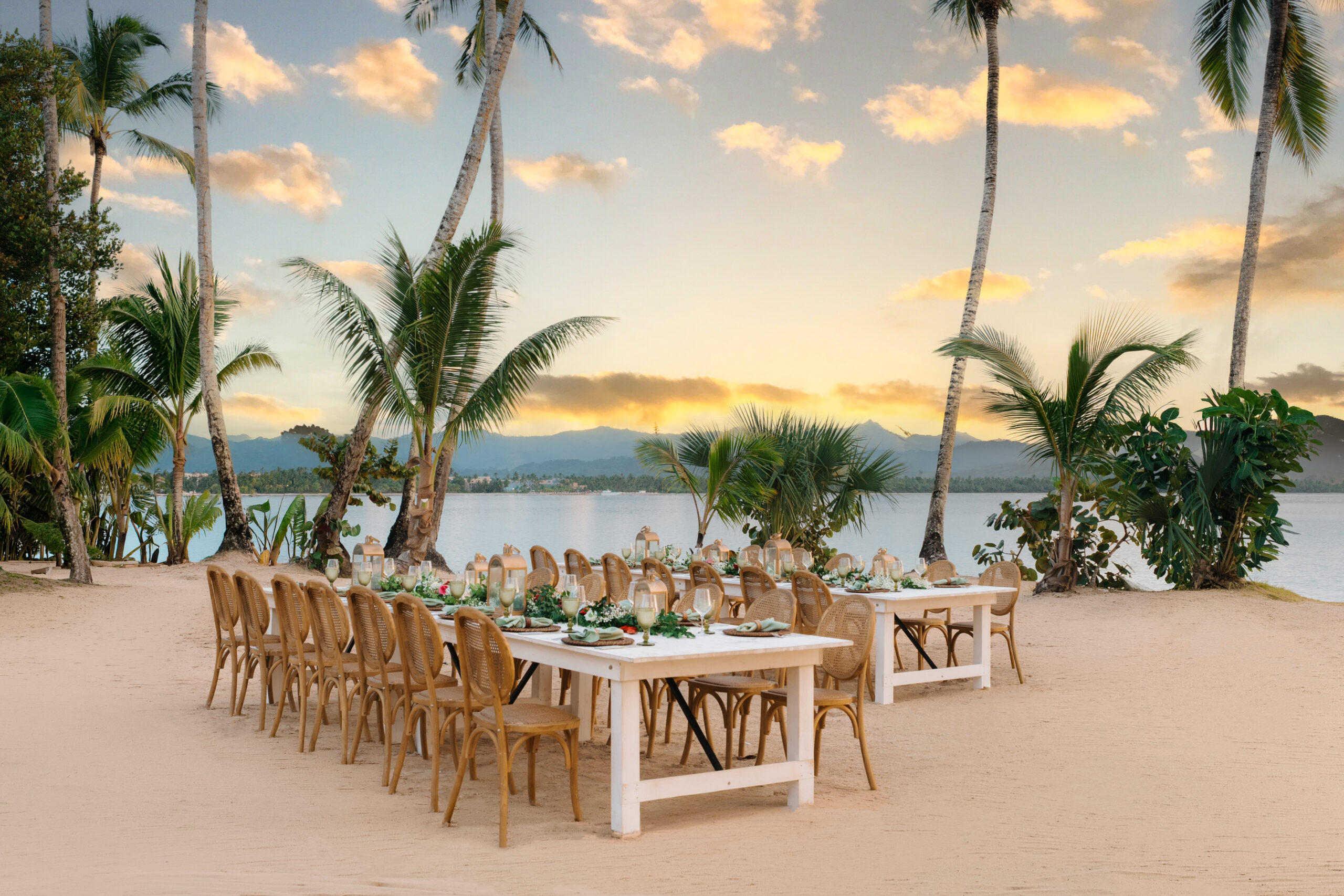 Outdoor dining setup at Zemi Miches All-Inclusive Resort with tables, chairs, and palm trees.