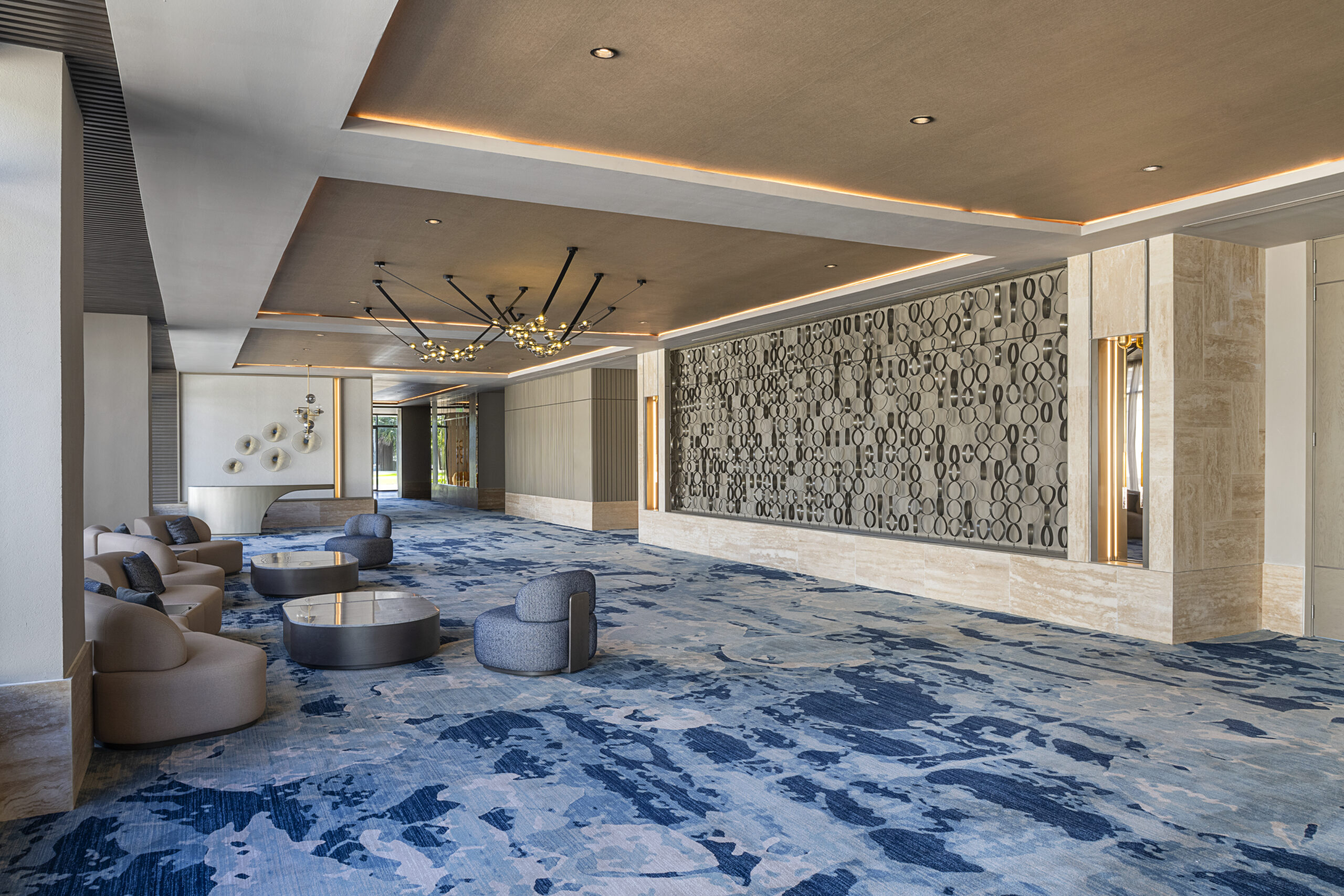 Zemi Miches All-Inclusive Resort lobby with blue carpet and lounge chairs