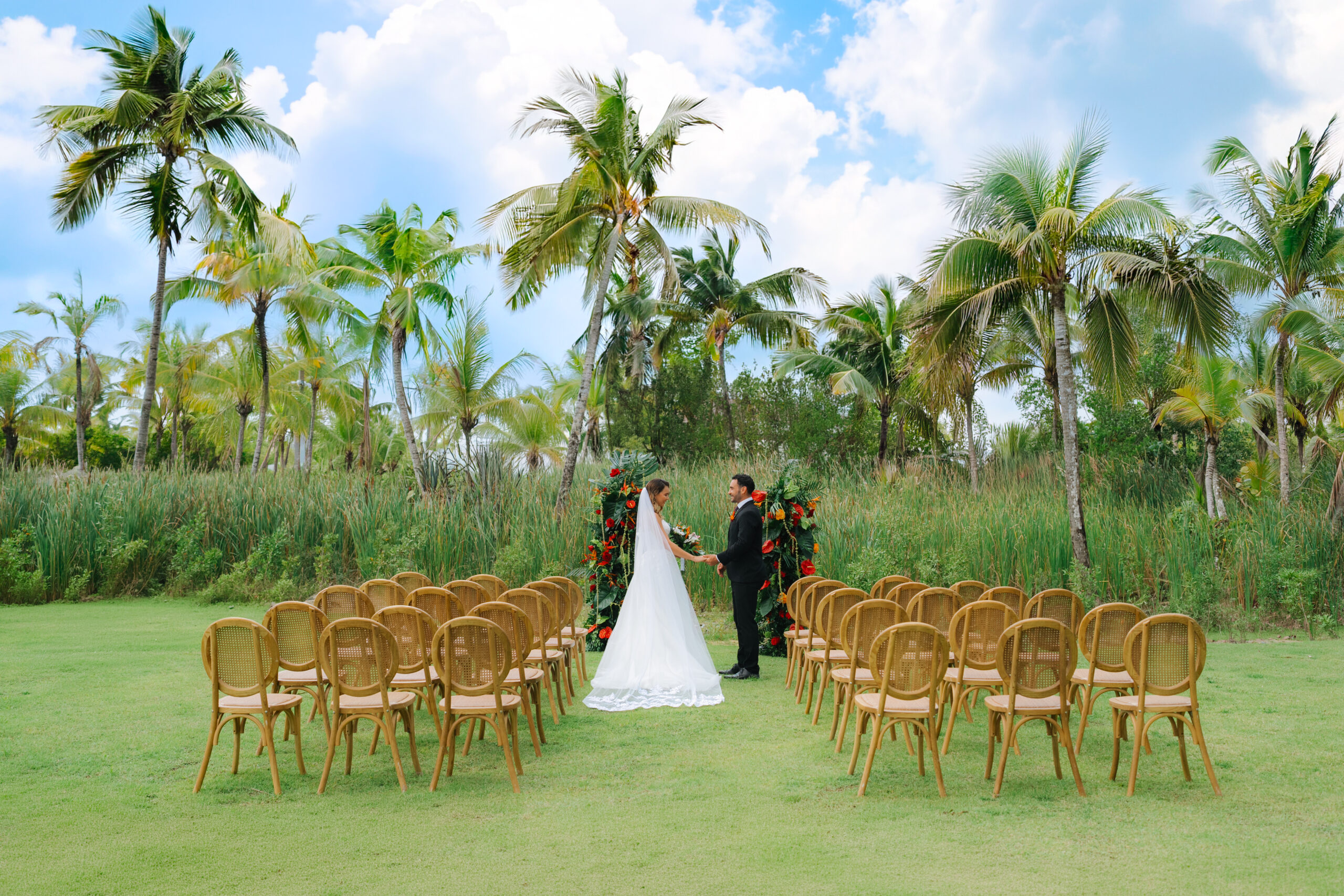 Wedding ceremony setup at Zemi Miches All-Inclusive Resort with palm trees.
