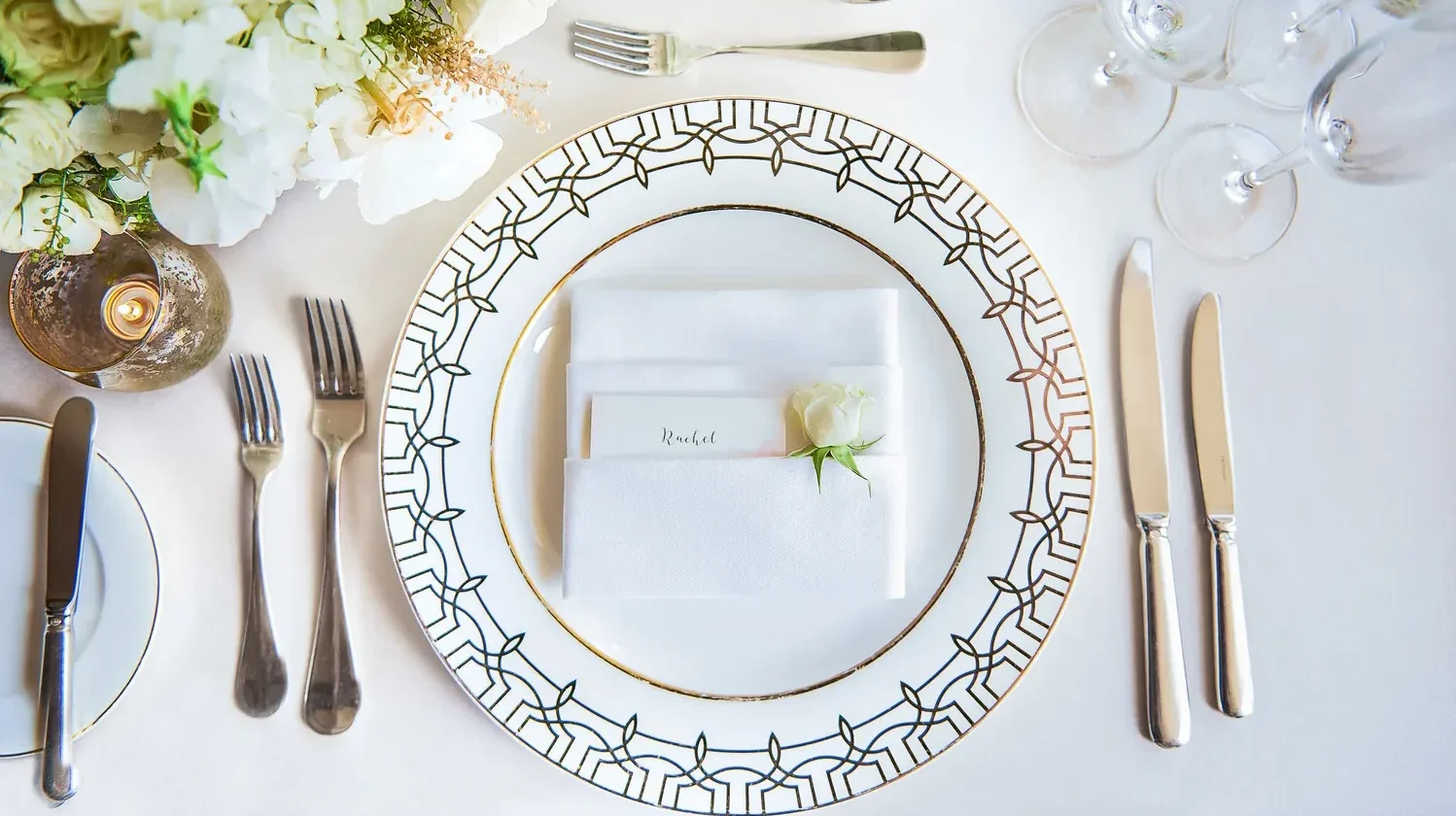 Elegant place setting with a name card for Rachel at a Beverly Hills wedding venue.