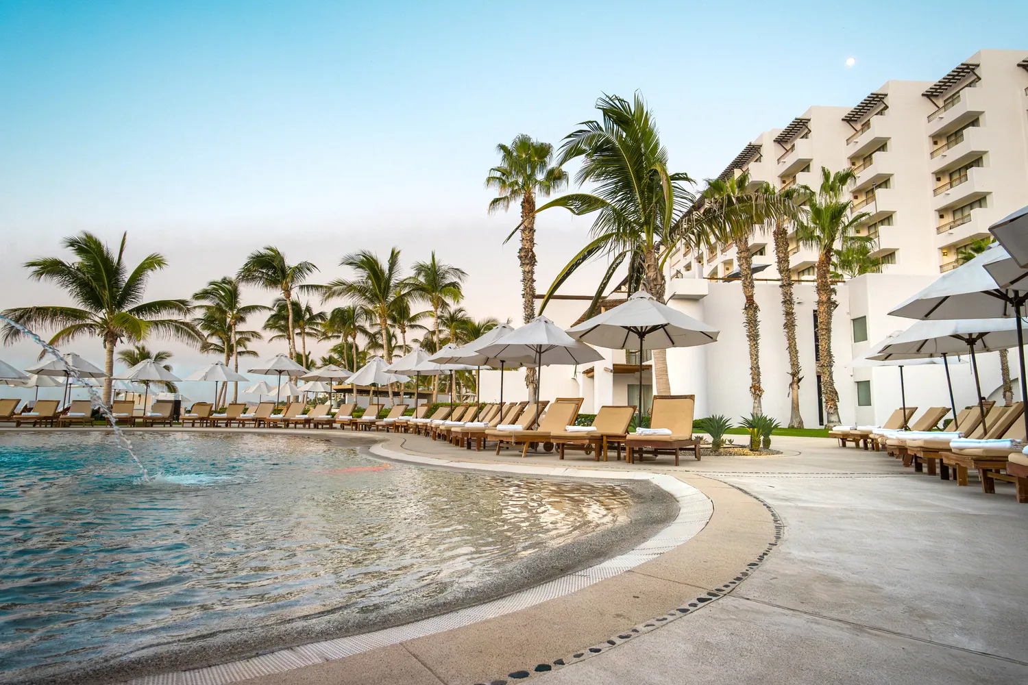 Luxury pool and lounge chairs at Marquis Los Cabos, a stunning Los Cabos wedding destination.
