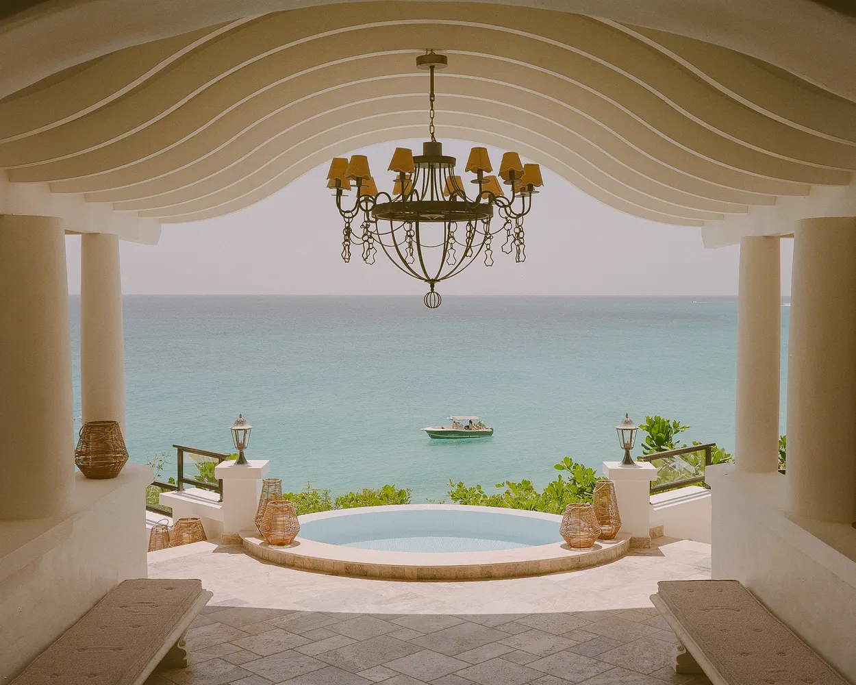 Oceanfront pool and chandelier at La Samanna, a Belmond Hotel, ideal Caribbean destination wedding venue.