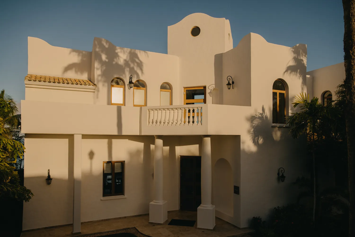 Luxury Caribbean villa at sunset, ideal destination wedding venue.