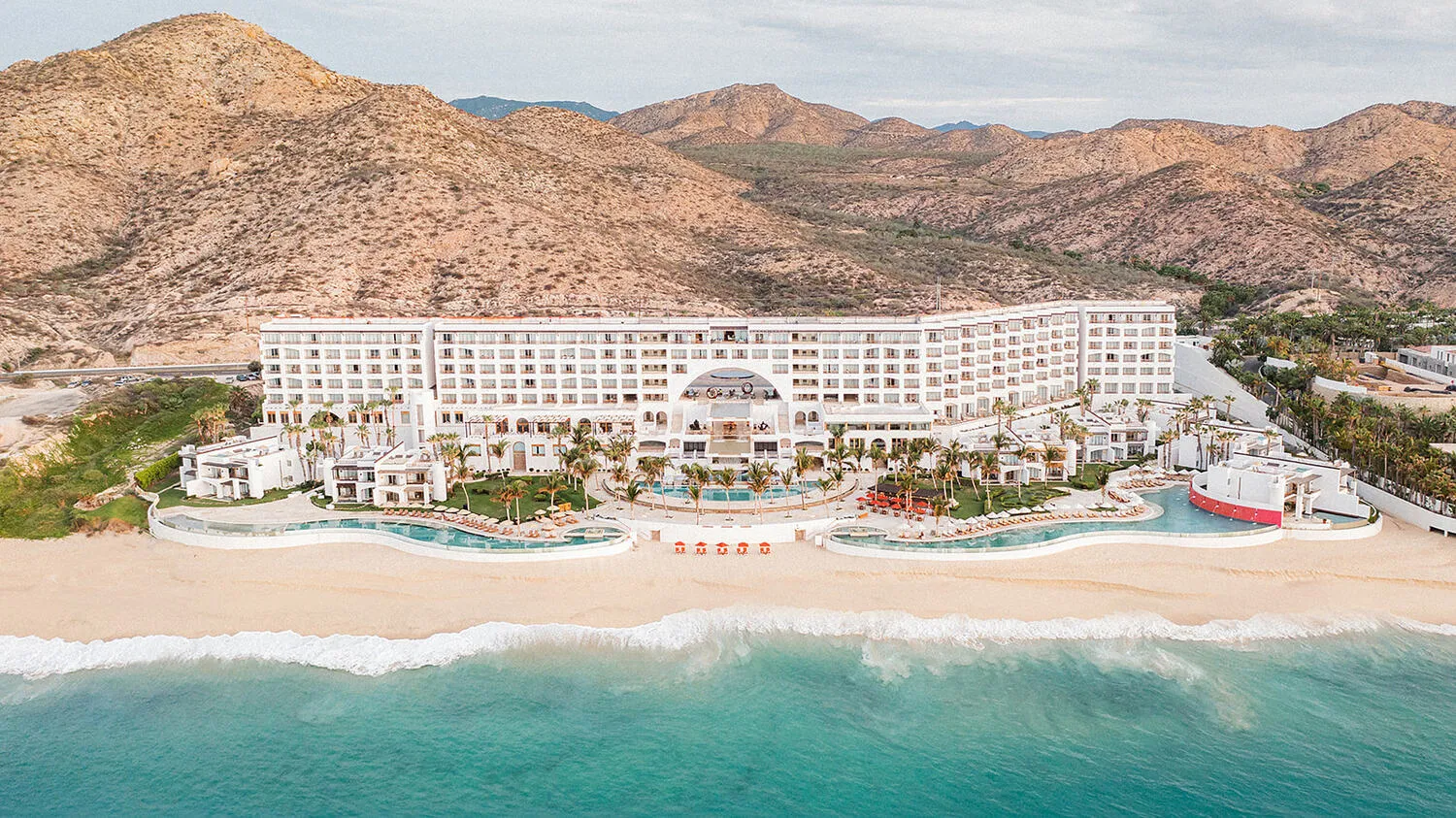 Aerial view of Marquis Los Cabos Resort & Spa, featuring stunning beachfront pools, a white sand beach, and a breathtaking oceanfront setting—ideal for a Los Cabos wedding destination.