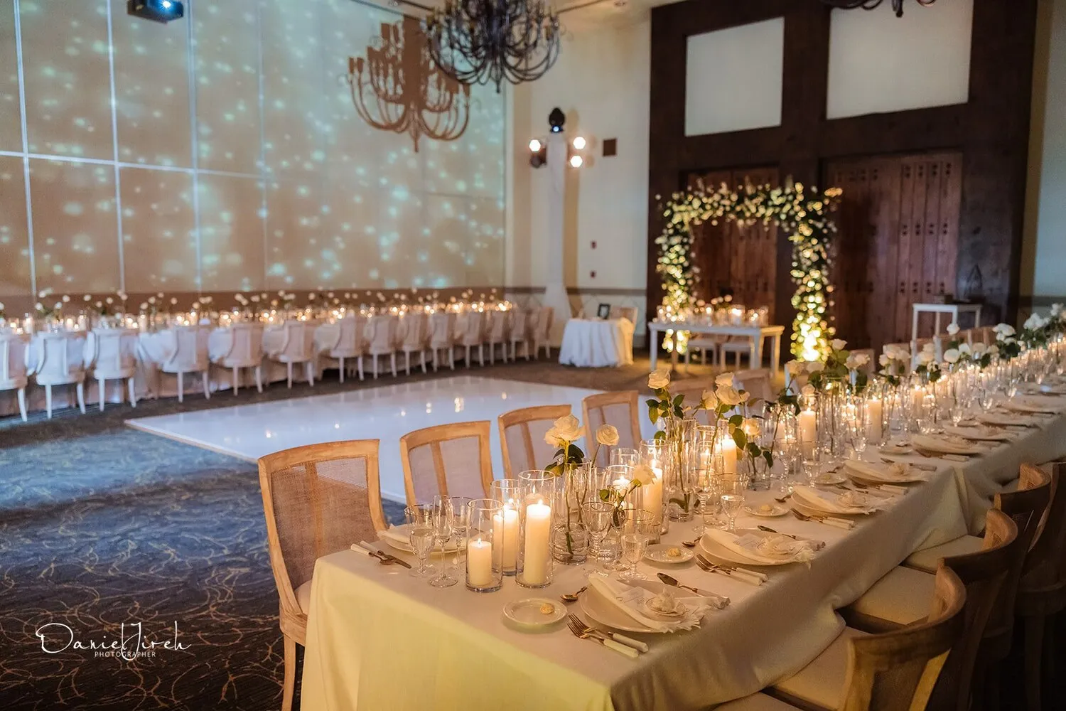 Elegant wedding reception at Marquis Los Cabos, featuring candlelit tables and floral centerpieces.