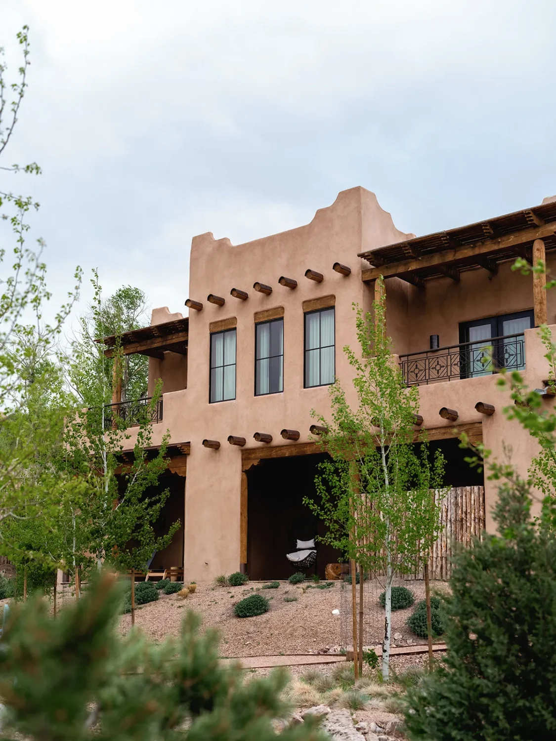 Adobe-style building with covered patios and landscaping.
