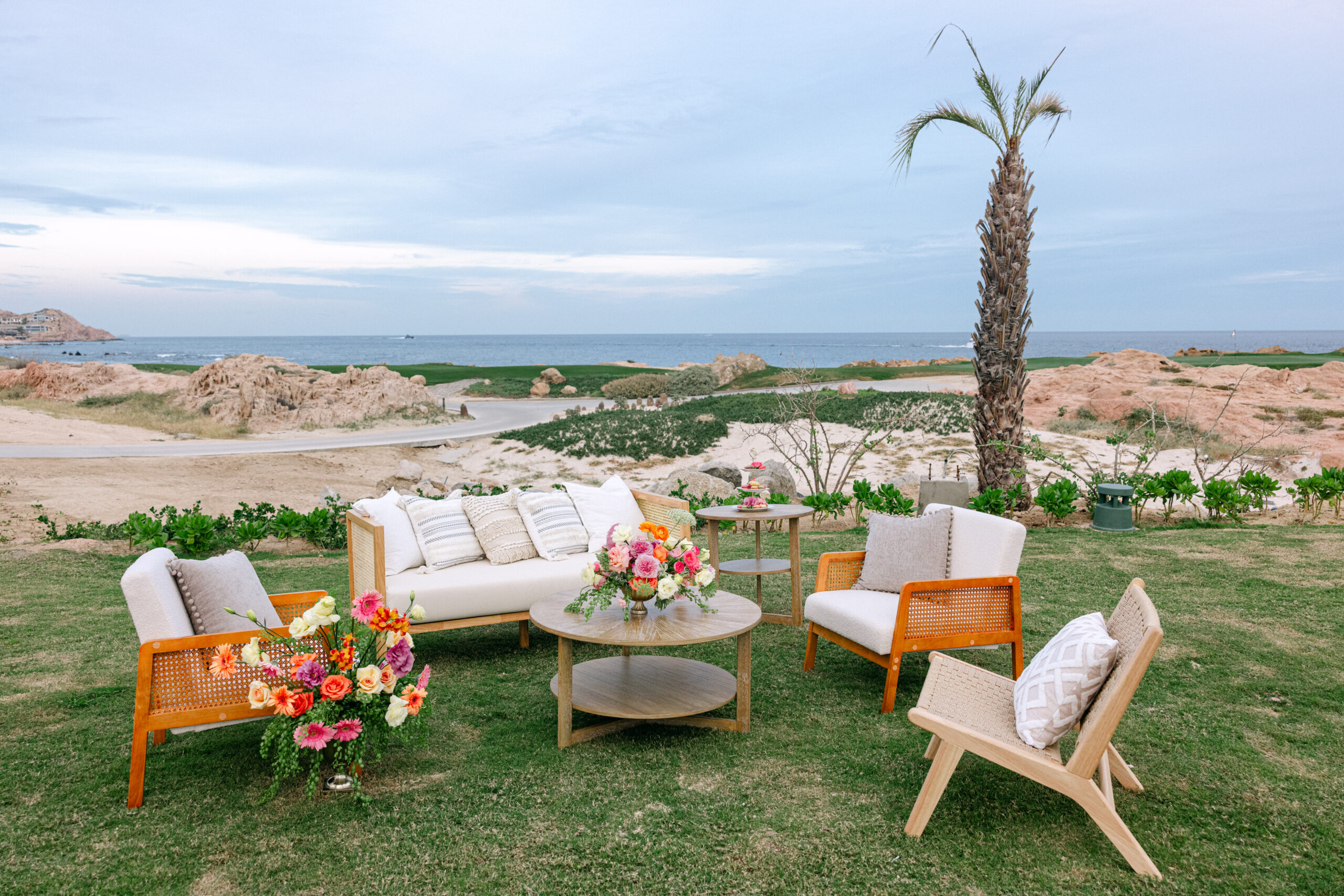 Park Hyatt Los Cabos wedding lounge area with ocean view. Outdoor seating with flowers.