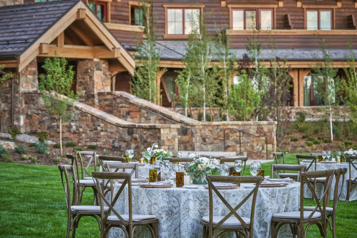 Outdoor reception tables set for a wedding at Montage Big Sky, a Montana wedding venue.