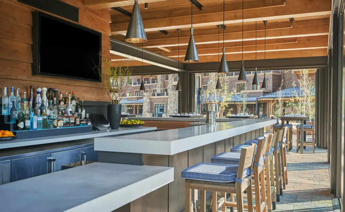Outdoor bar at Montage Big Sky, a Montana wedding venue, with seating and drinks