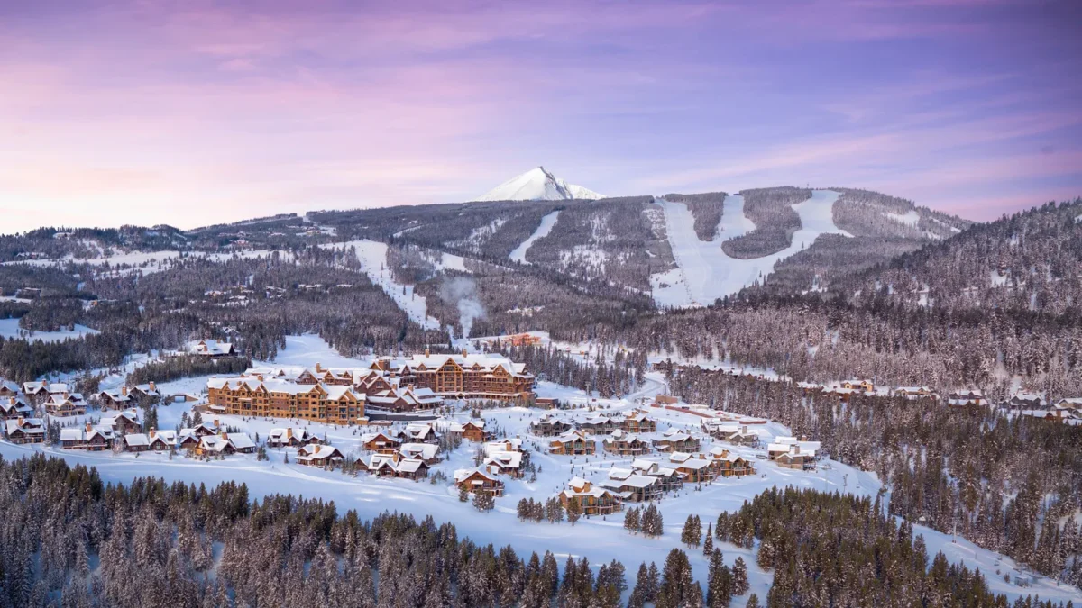 Winter landscape of Montage Big Sky, a Montana wedding venue, with snow-covered buildings and ski slopes.