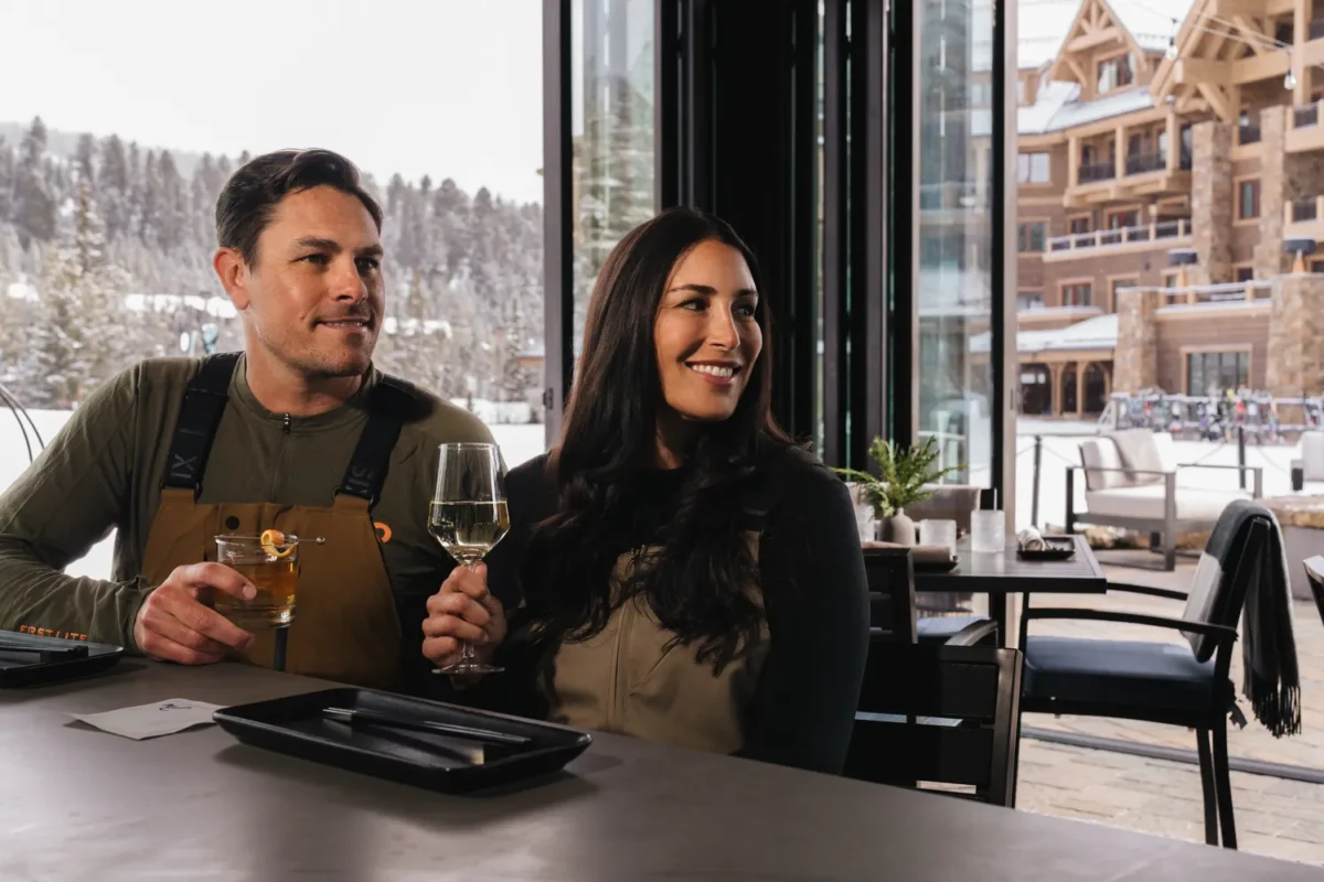 Couple enjoying drinks at a bar, Montage Big Sky, Montana wedding venue