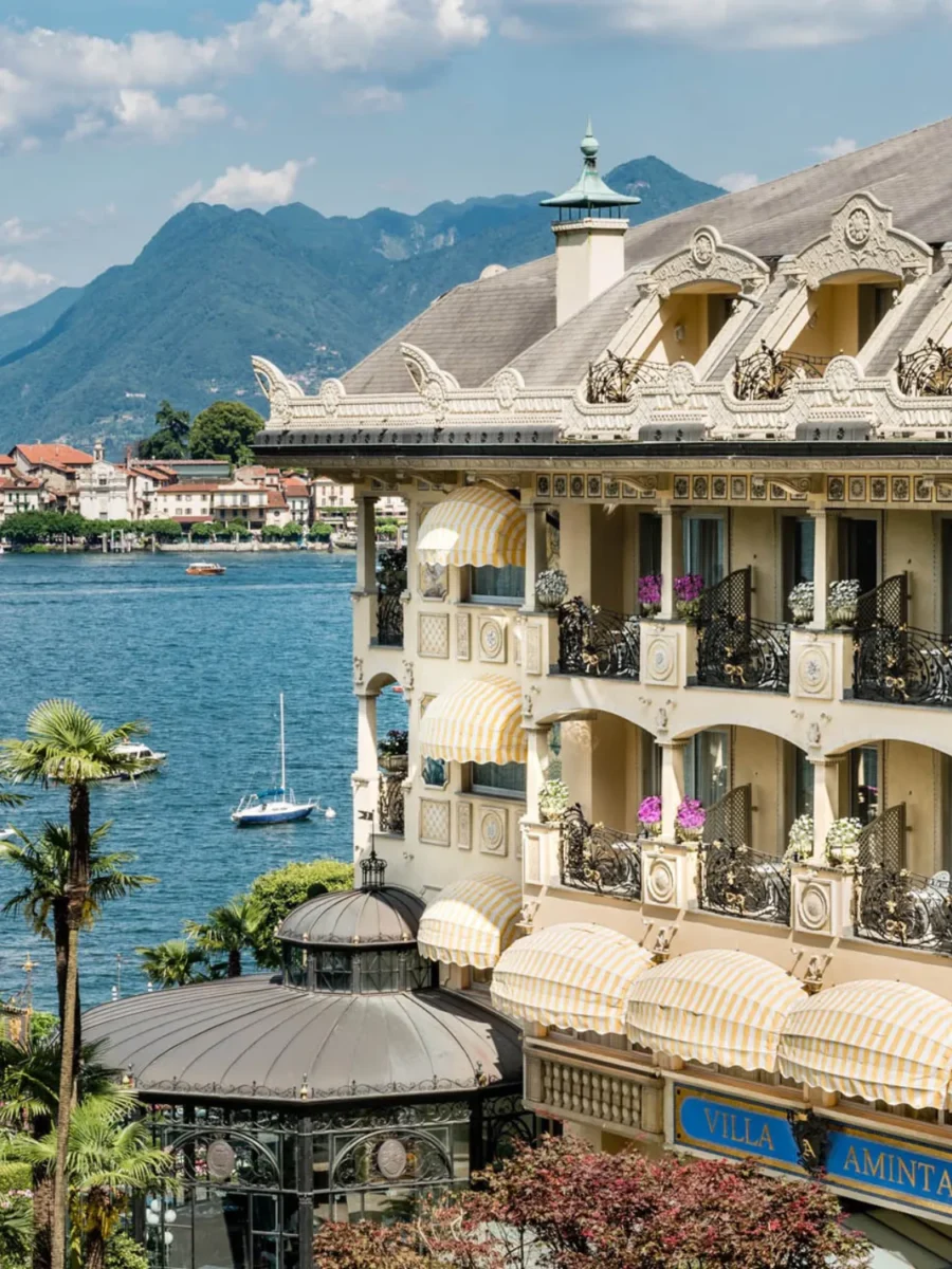 Villa Aminta hotel on Lake Maggiore, Italy. Luxurious architecture with balconies and mountain views.