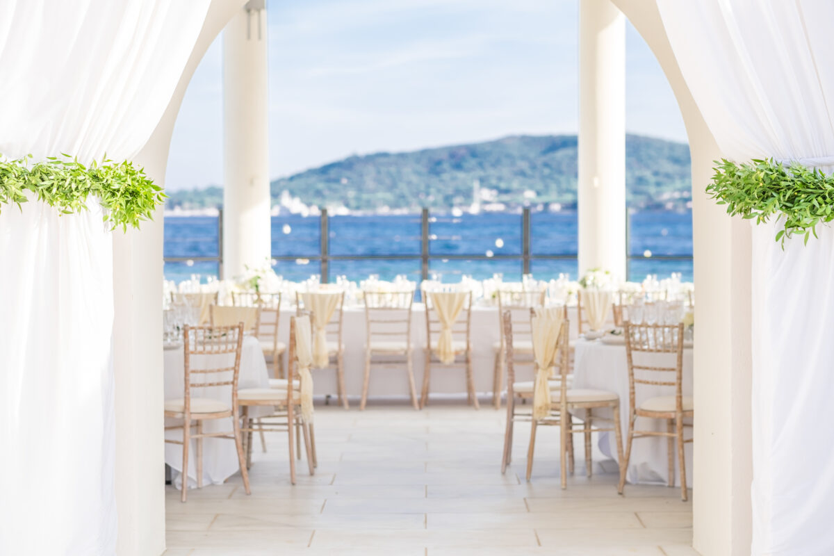 Luxury wedding setup at COMO Le Beauvallon in Saint-Tropez, with ocean view and white decor.