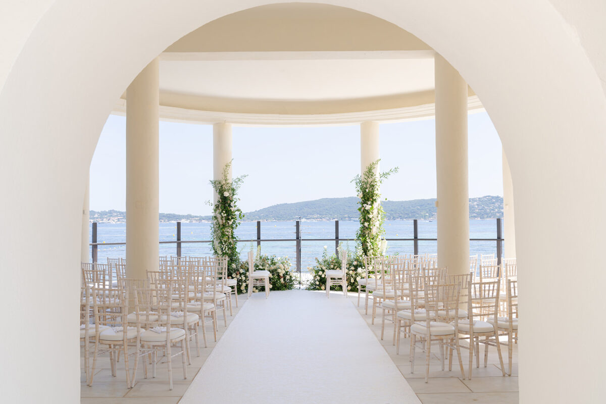 Luxury wedding in Saint-Tropez at COMO Le Beauvallon: Ceremony setup with sea view.