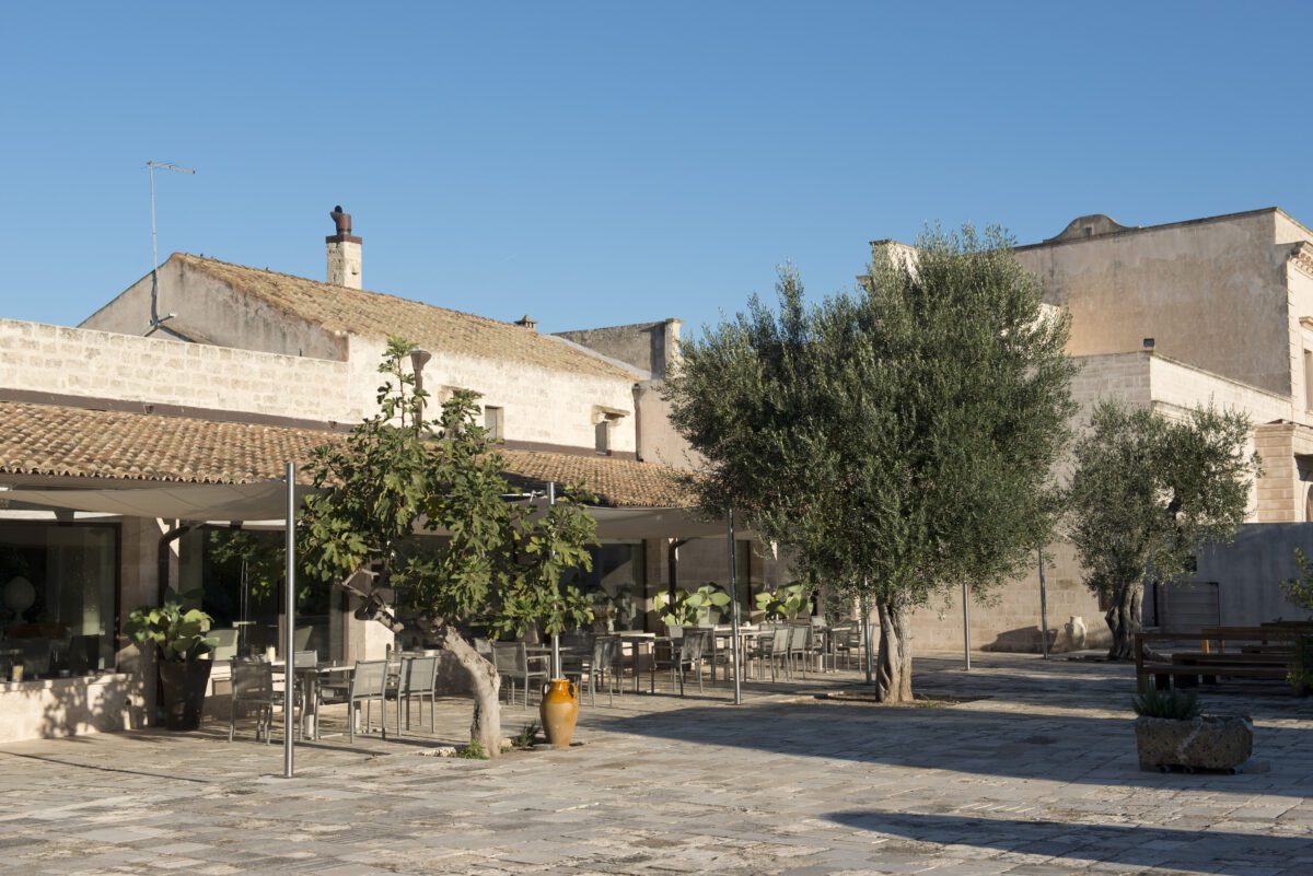 Outdoor dining area at Relais Histò Hotel & SPA, Puglia, Italy.