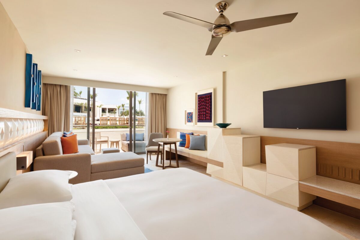 Hyatt Ziva Cancún suite featuring a king bed and ocean view.