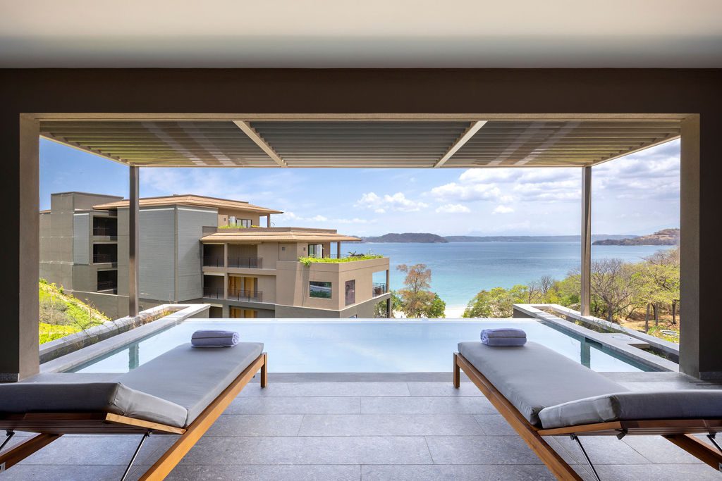 Waldorf Astoria Costa Rica ocean view with infinity pool and lounge chairs.
