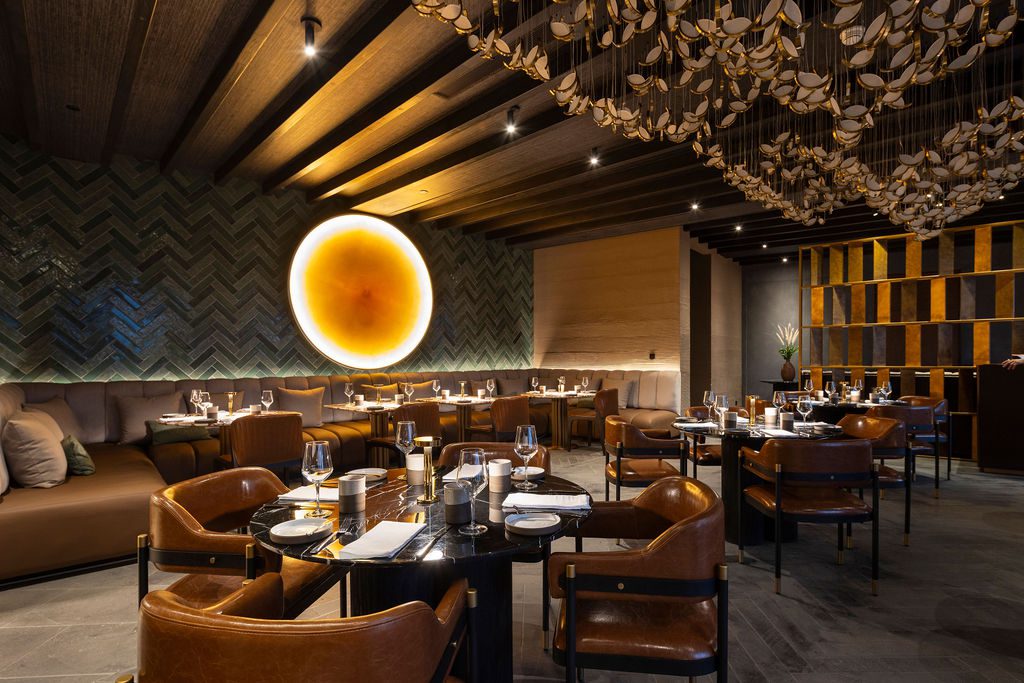 Elegant dining room at Waldorf Astoria Costa Rica with stylish decor and inviting ambiance.