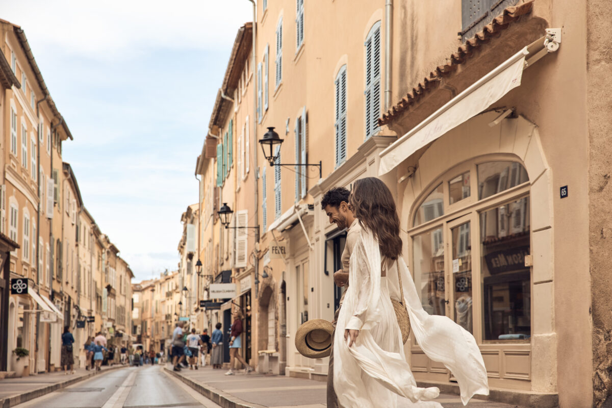 Couple walking in historic Saint-Tropez street