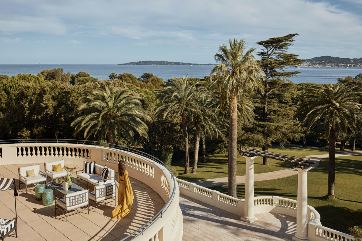 Luxury terrace overlooking the sea and palm trees in Saint-Tropez