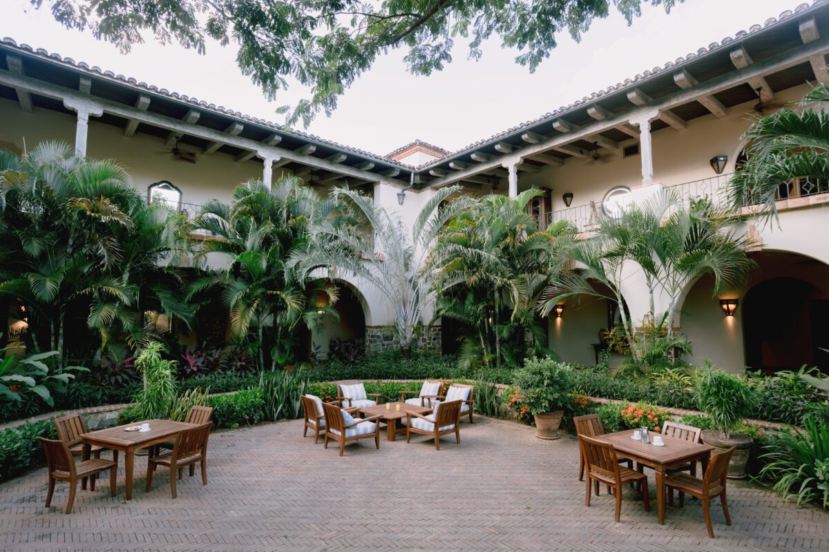 Tropical courtyard with patio seating at Rancho Santana