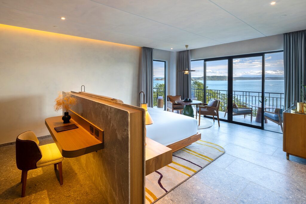Luxurious Waldorf Astoria Costa Rica suite with ocean view, balcony, and modern design.