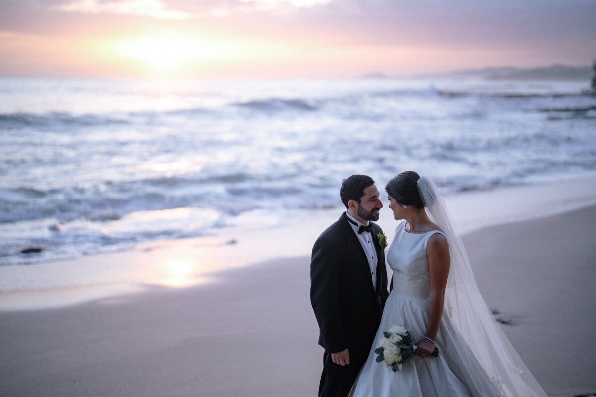 Rancho Santana wedding: Bride and groom on a beach at sunset.