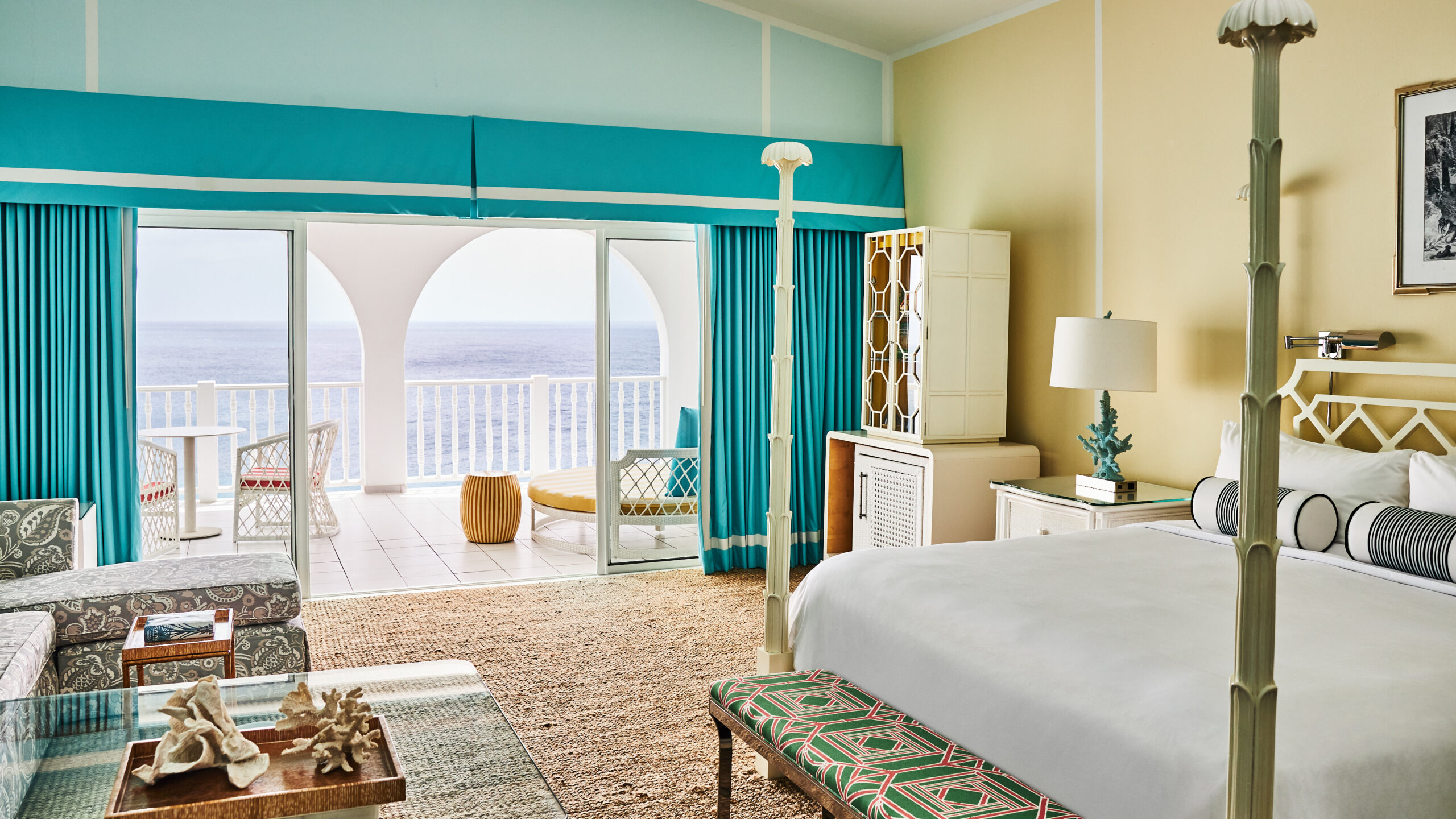 Malliouhana resort bedroom with ocean view balcony.