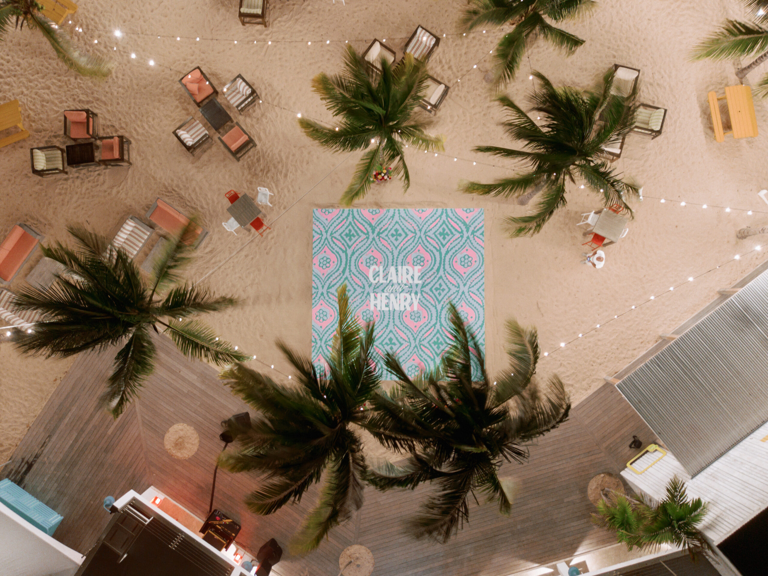 Aerial view of Malliouhana resort event with palm trees and seating areas.
