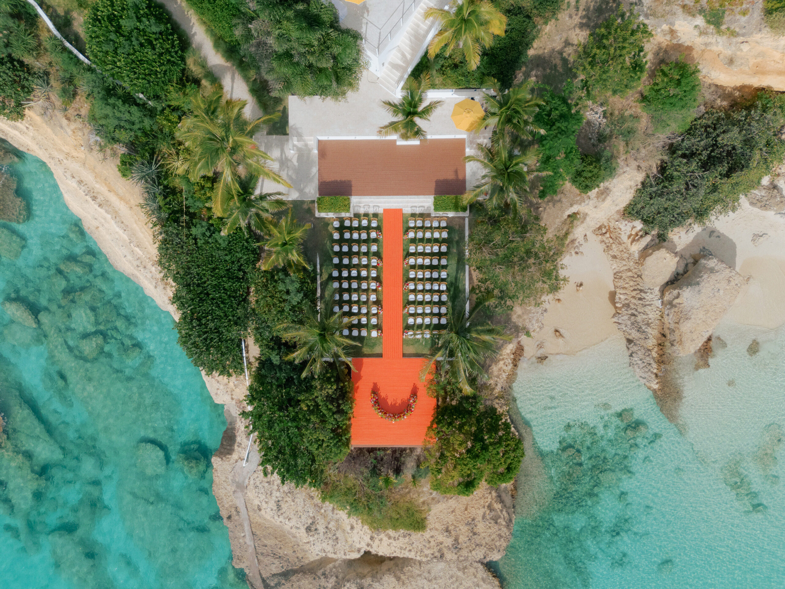 Malliouhana, Anguilla: Aerial view of a stunning seaside wedding setup.