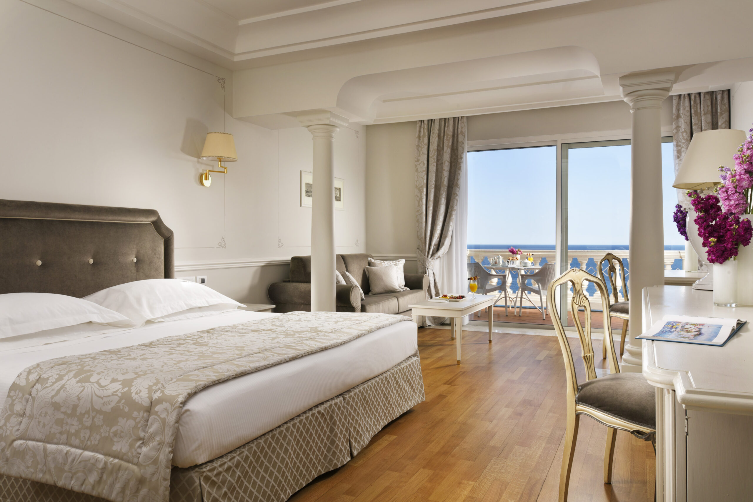 Luxury hotel room in Sanremo with balcony overlooking the sea.