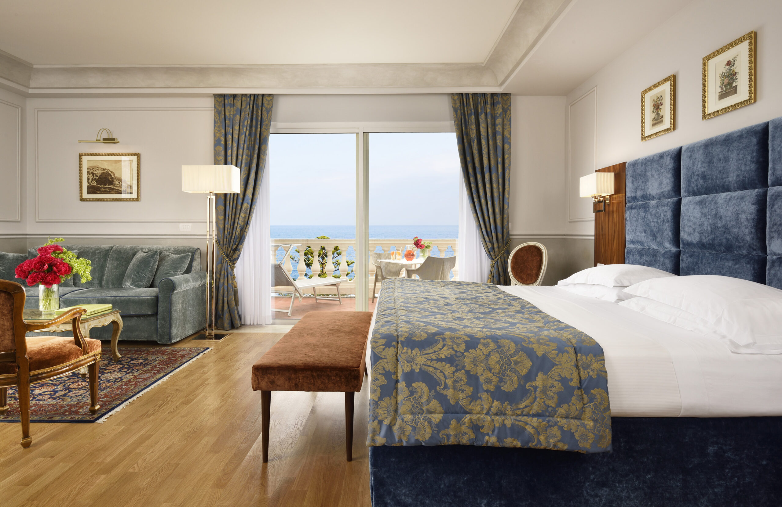 Luxury suite at Royal Hotel Sanremo with balcony and ocean view.