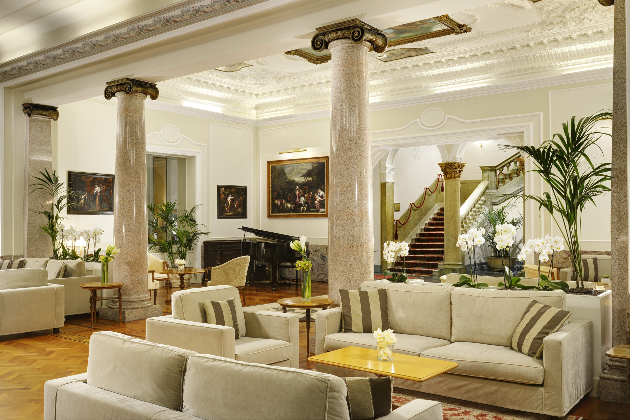 Royal Hotel Sanremo lobby with elegant seating and grand staircase. Luxury wedding venue.