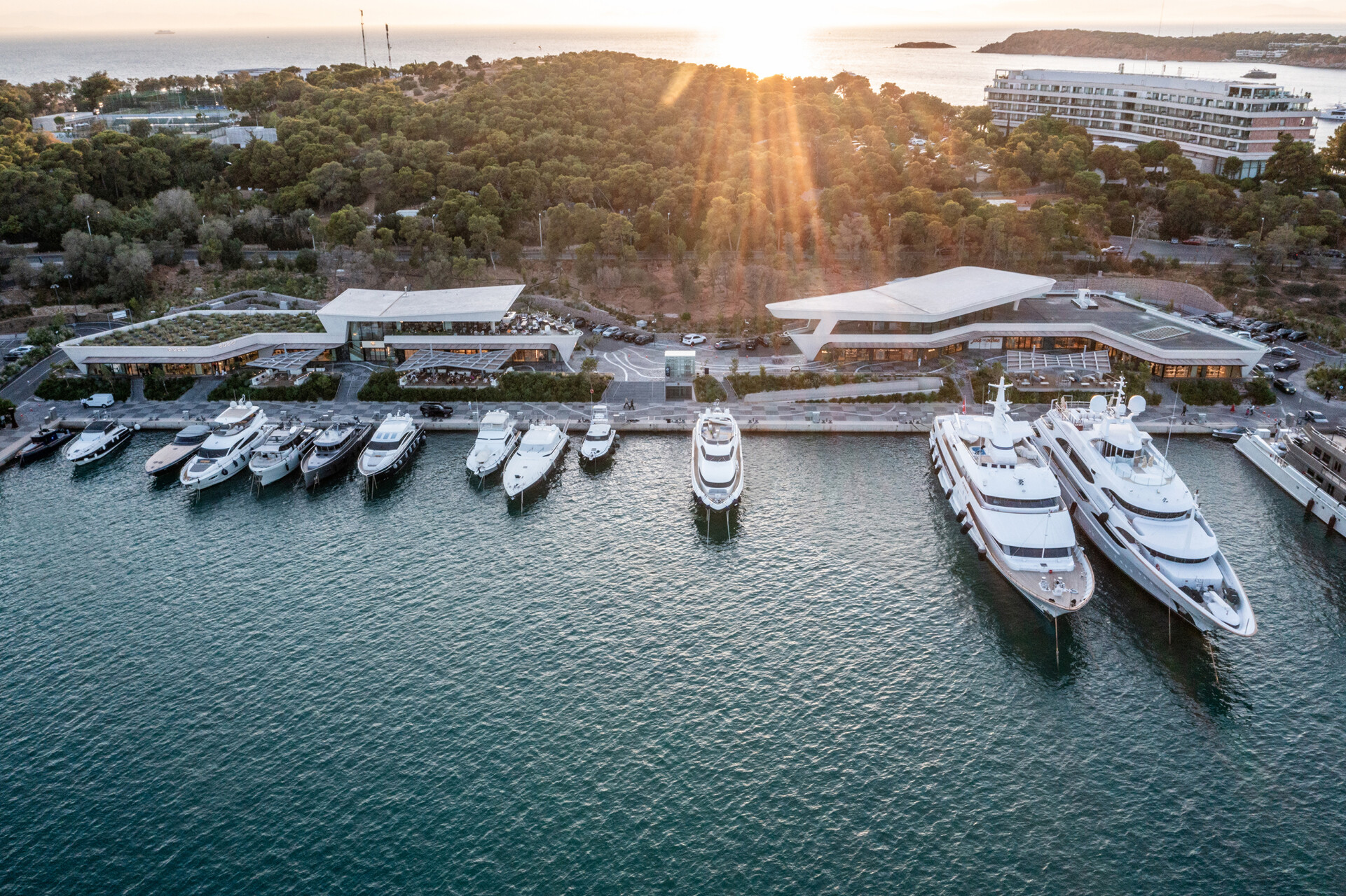 Luxury yachts docked at Four Seasons Astir Palace, Athens, at sunset.