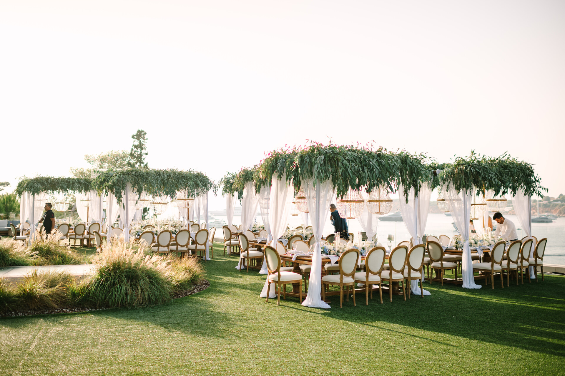 Elegant outdoor wedding reception at Four Seasons Astir Palace, Athens.