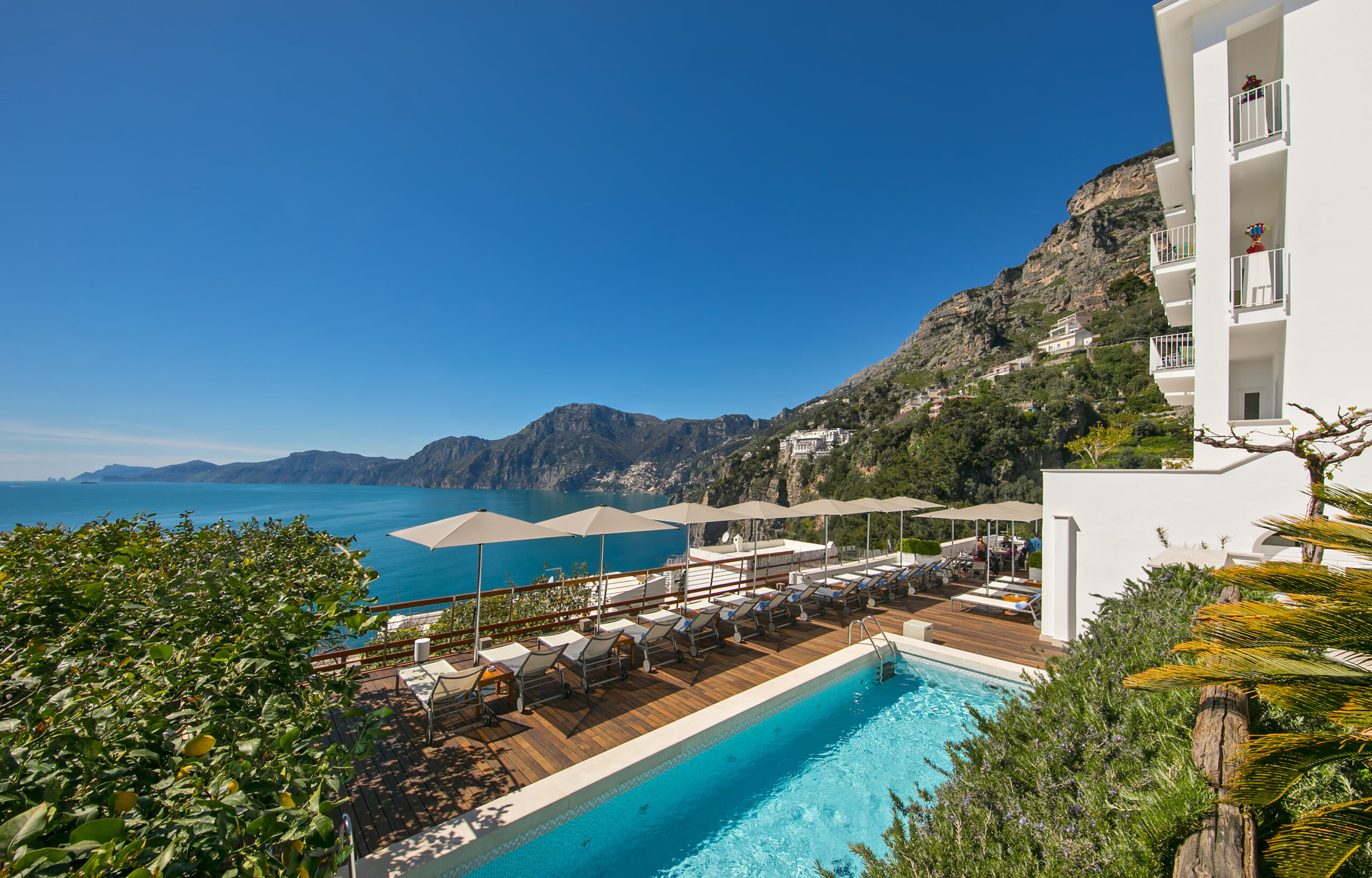 Luxury adults-only resort with pool overlooking the Amalfi Coast, perfect for weddings and honeymoons.