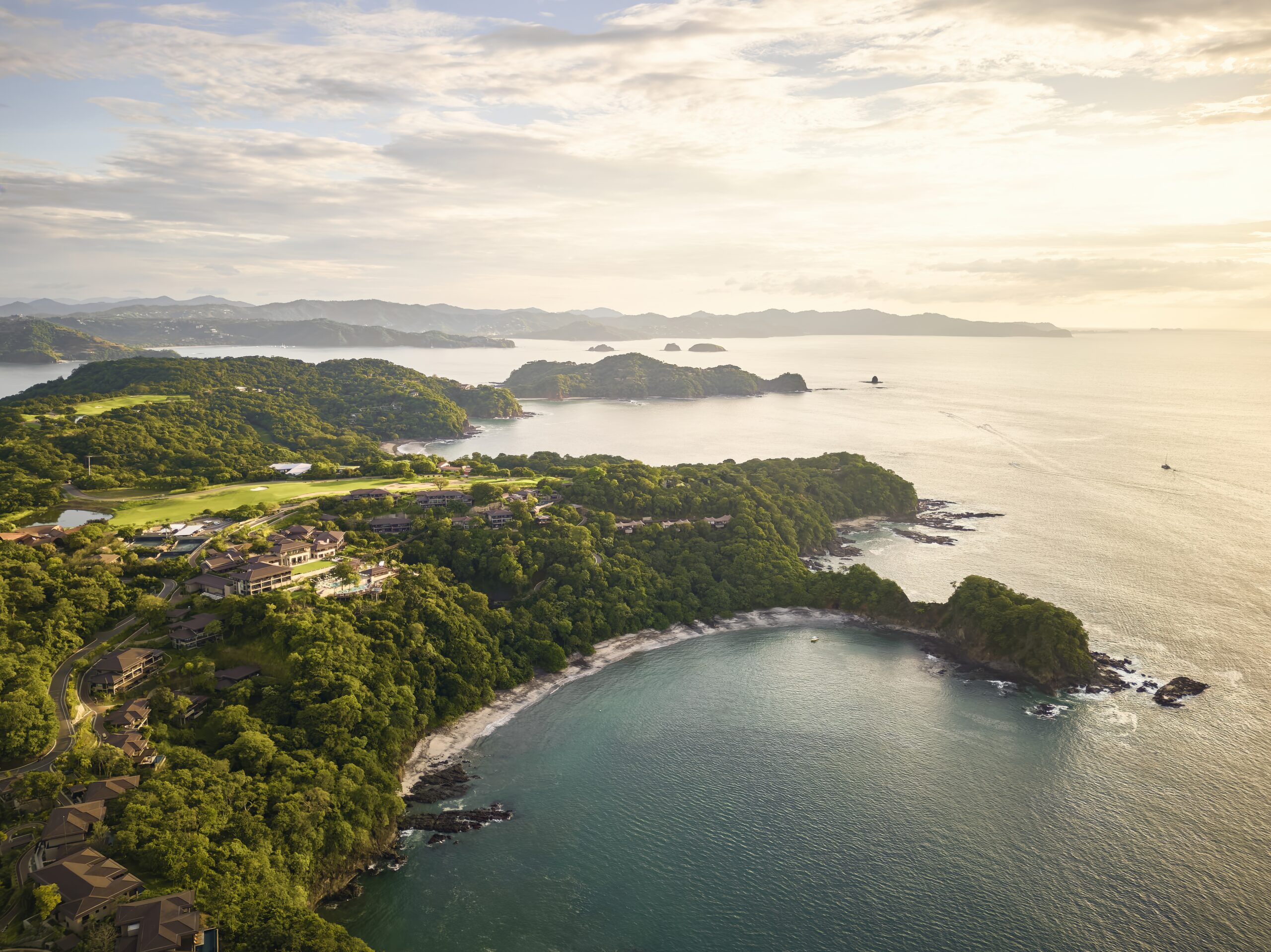 Aerial view of Nekajui, a Ritz Carlton Reserve, a stunning wedding venue in Costa Rica with lush landscape and ocean views.