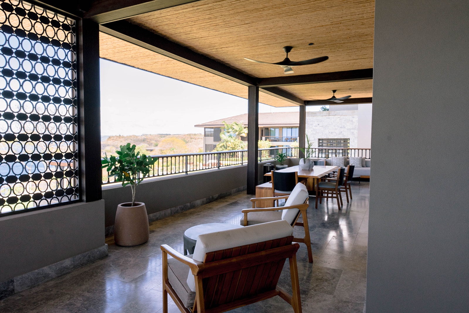 Nekajui Ritz Carlton Reserve: Outdoor lounge area with seating and scenic views.