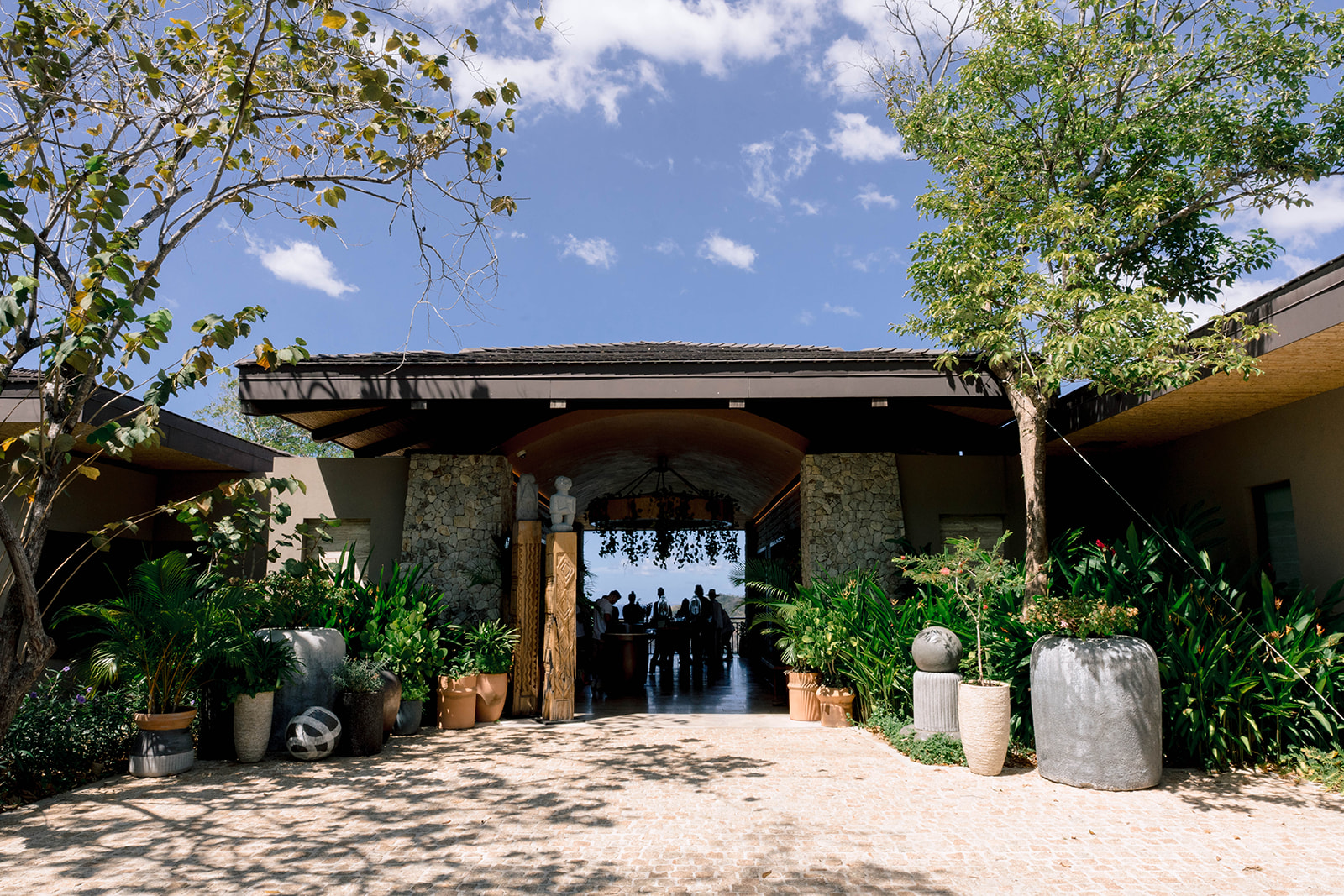 Nekajui Ritz Carlton Reserve entrance with lush landscaping.