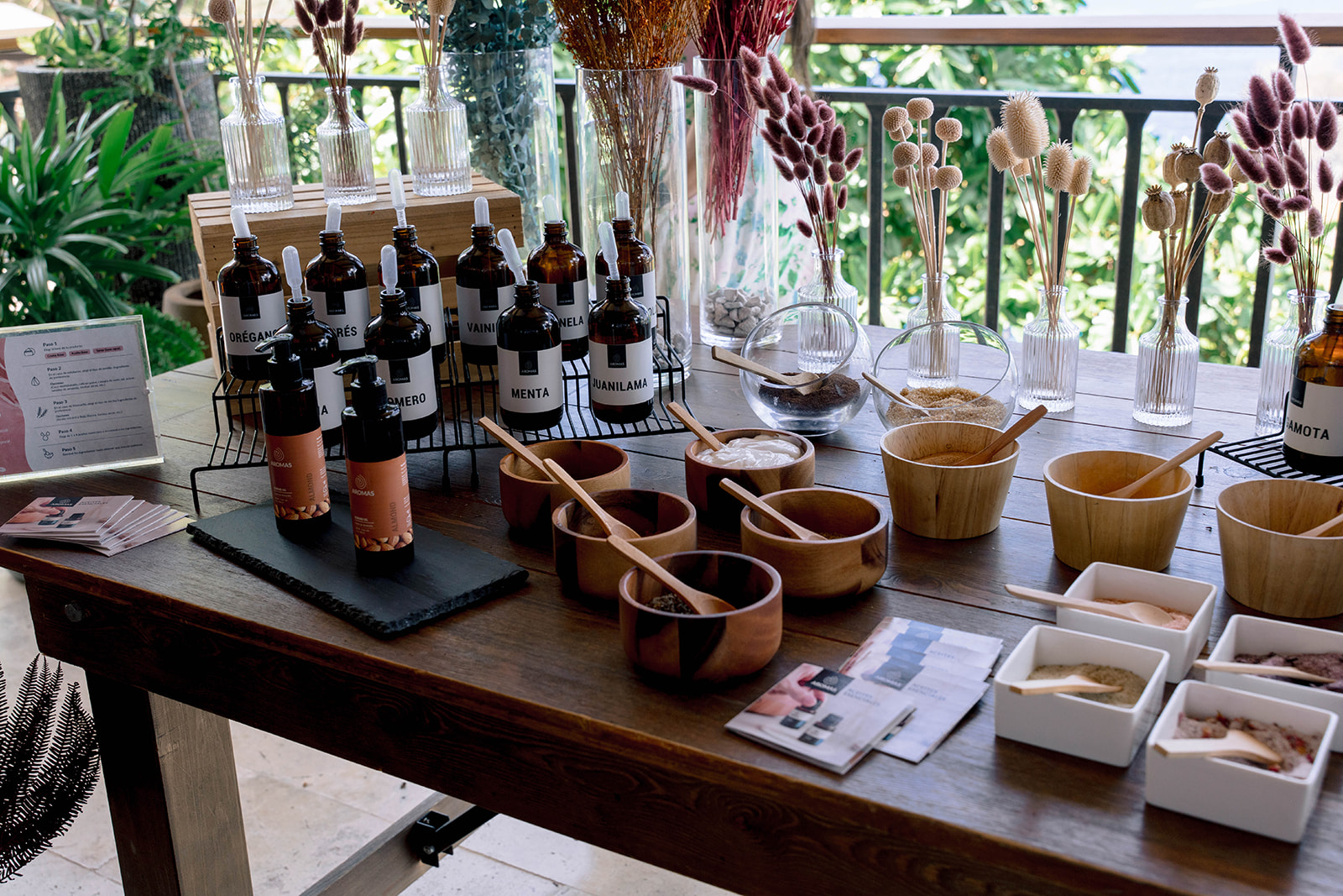Nekajui Ritz Carlton Reserve: DIY spa ingredients display with oils, herbs, and wooden bowls.