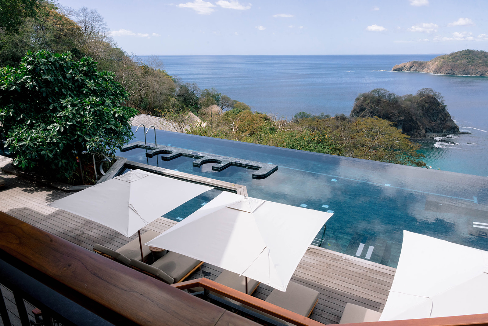 Nekajui, a Ritz Carlton Reserve infinity pool overlooking the ocean.