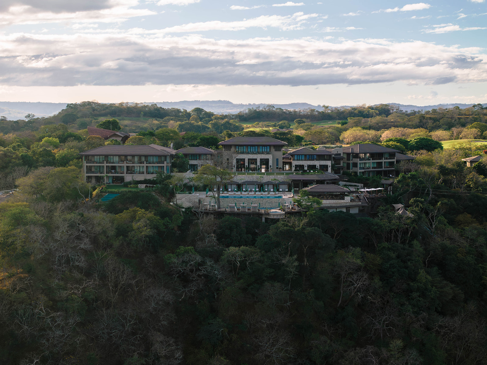 Nekajui, a Ritz Carlton Reserve, luxury resort on a lush hillside.