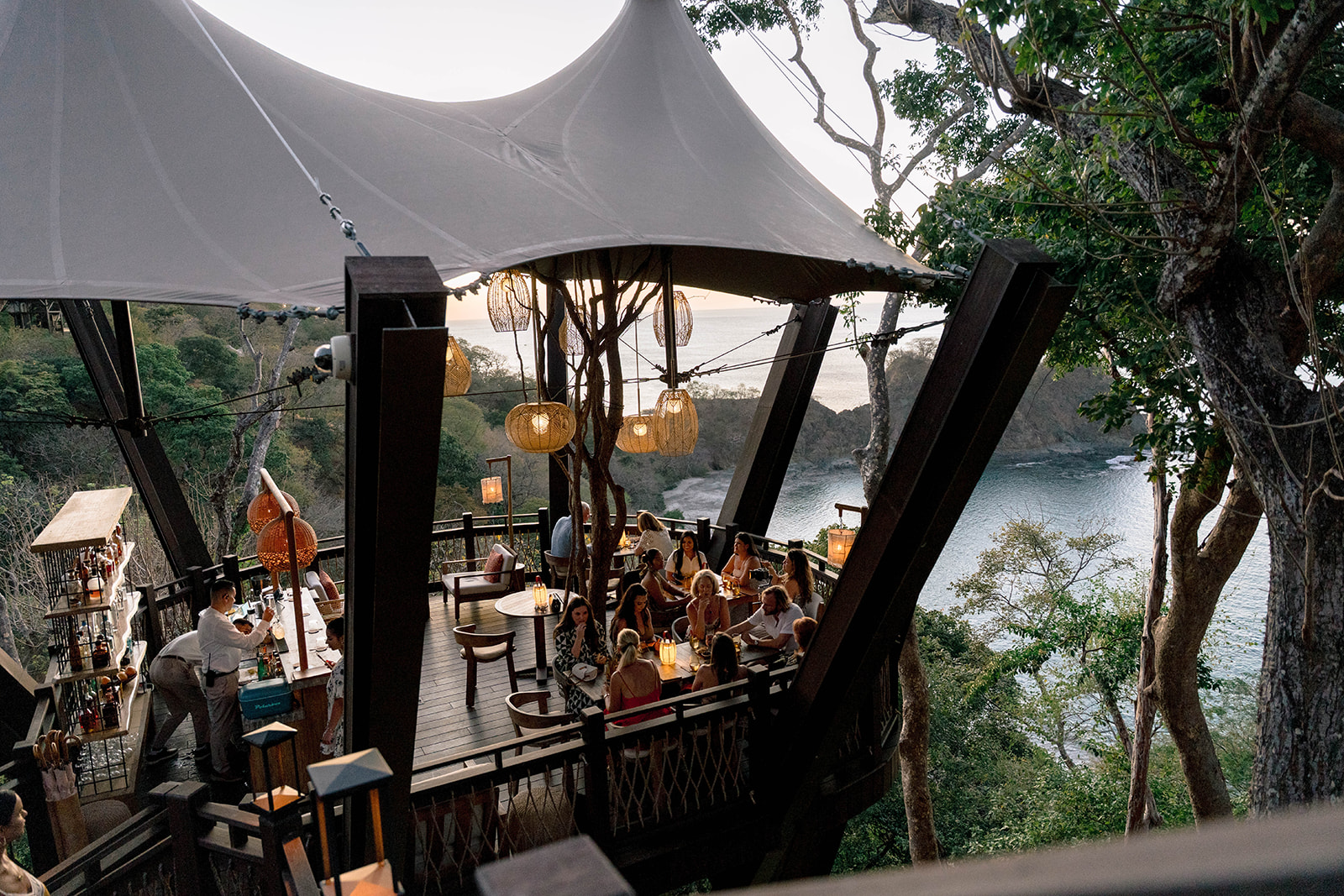Outdoor dining at Nekajui, a Ritz Carlton Reserve, with ocean view.