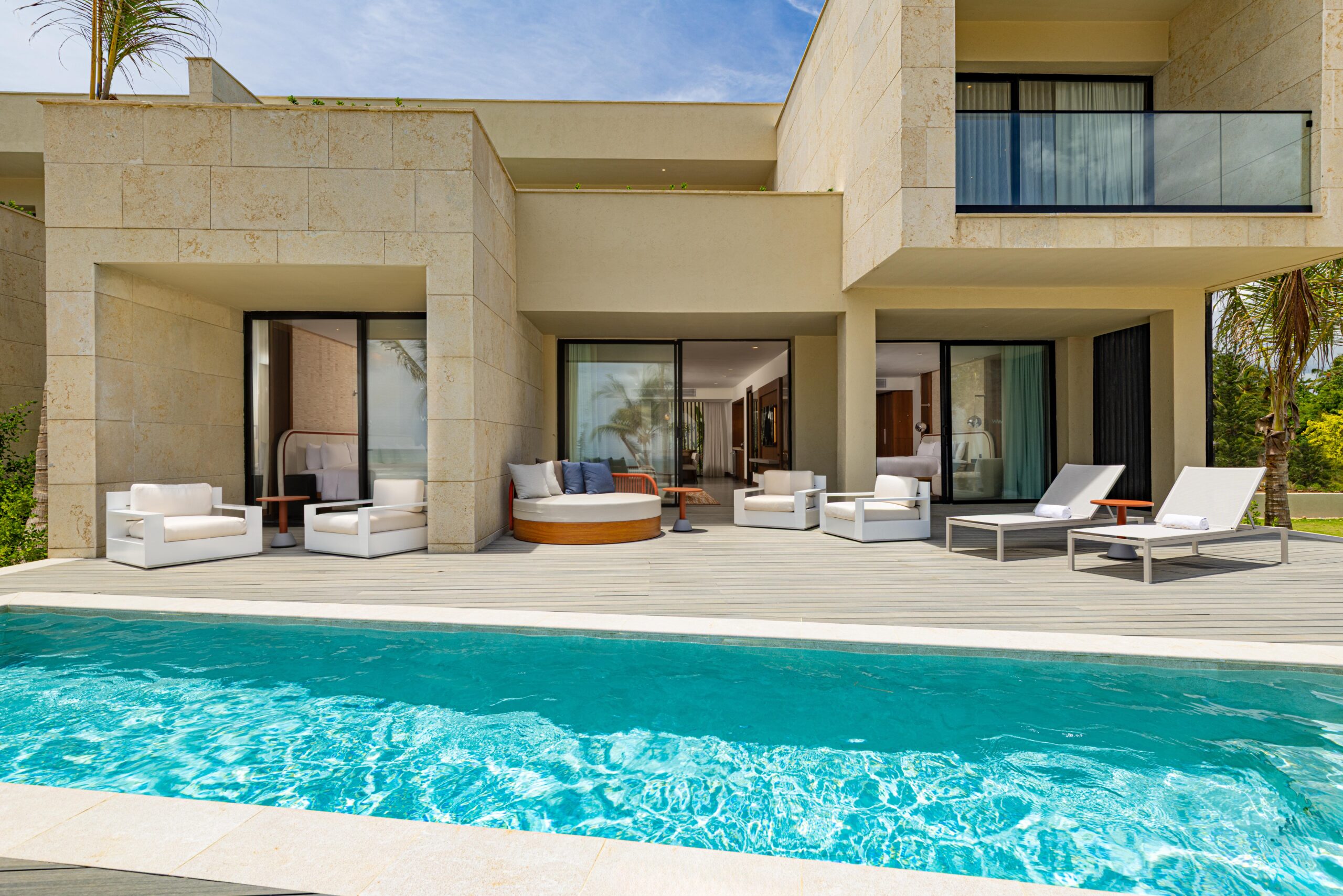 W Punta Cana resort villa with private pool and lounge chairs.