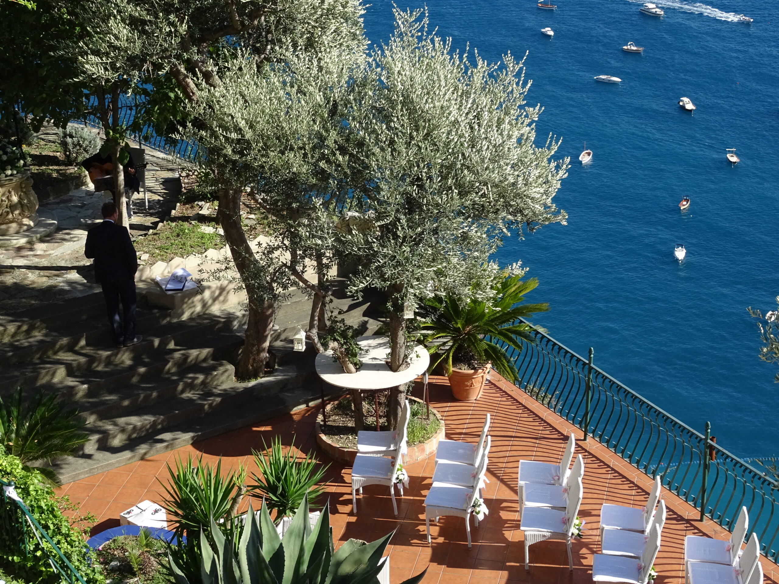 Wedding setup at one of Italy's private celebration villas, overlooking the sea.